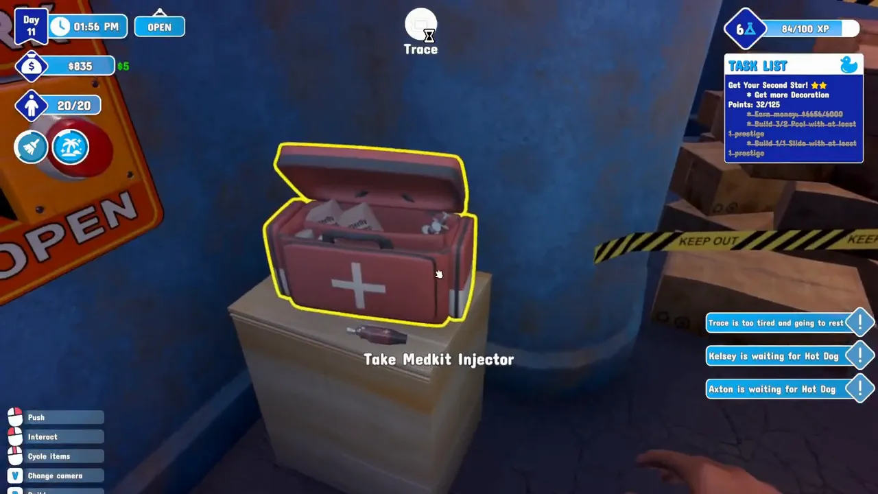 A red medkit outlined in yellow on a cabinet next to a big red button, with the prompt Take Medkit Injector