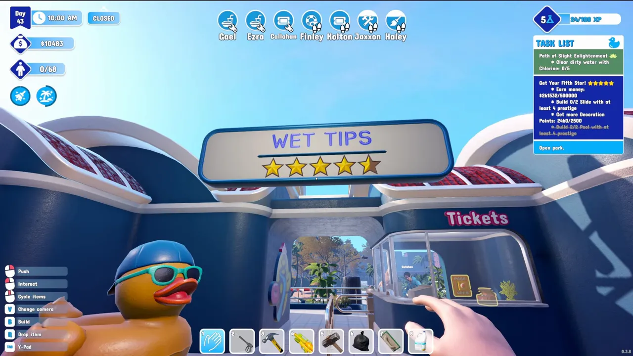 The park entrance sign reading WET TIPS with four and a half stars, above a rubber duck and the ticket window